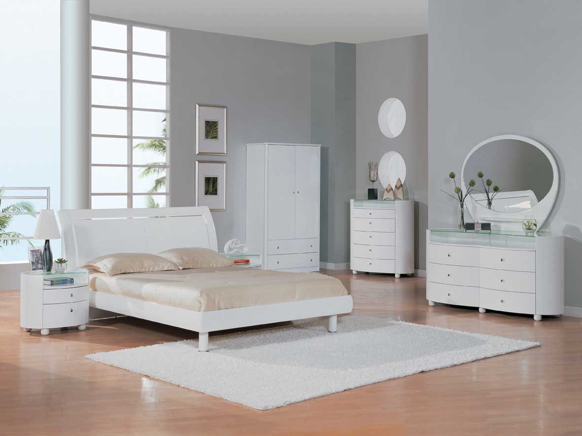 white bedroom with wood furniture